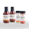 Four bottles of Jack Stack Barbecue products on a white background