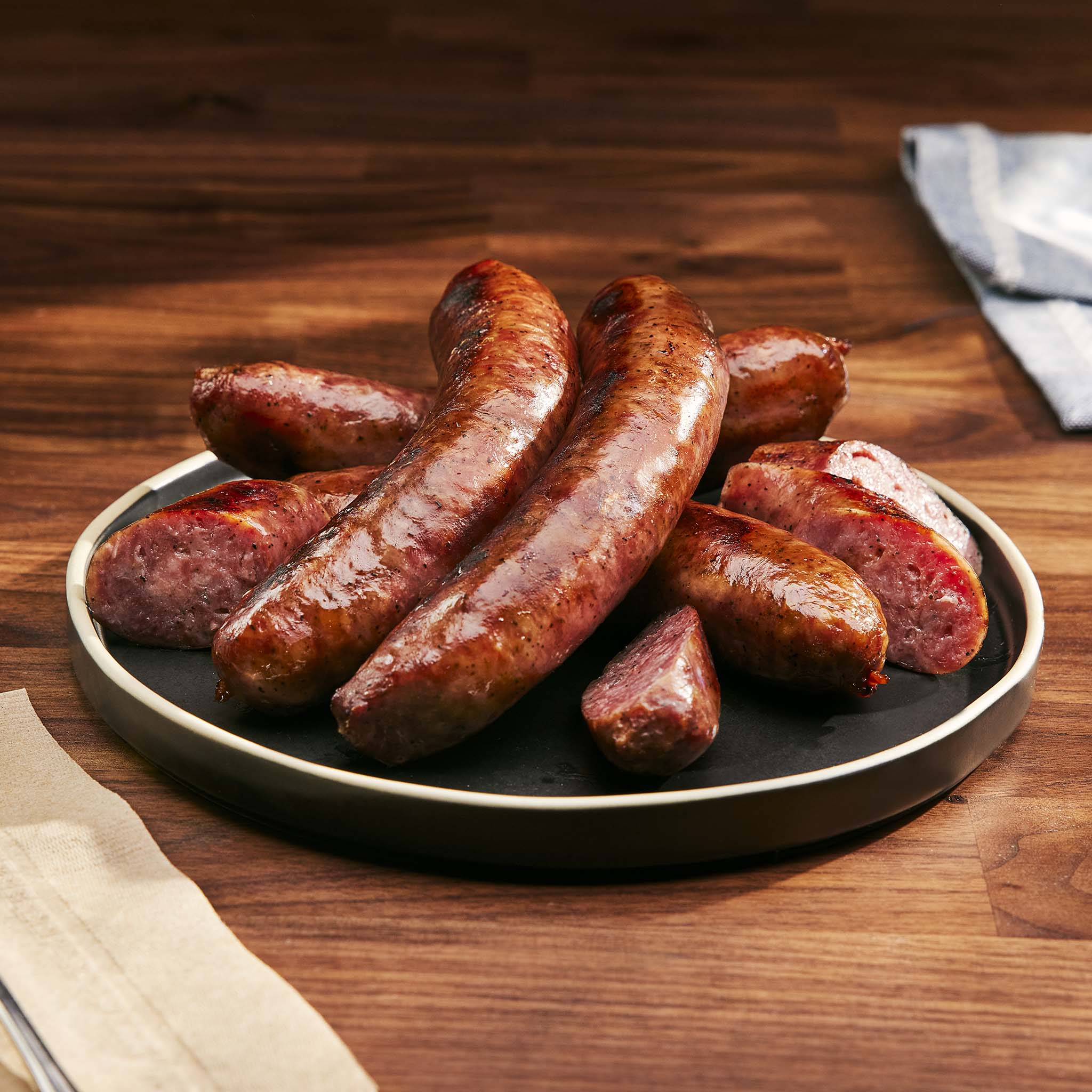 Platter of sausages on a wooden table