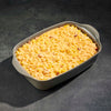 Rectangular baking dish with corn casserole on a dark gray background