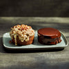 Two desserts on a gray plate with a dark background