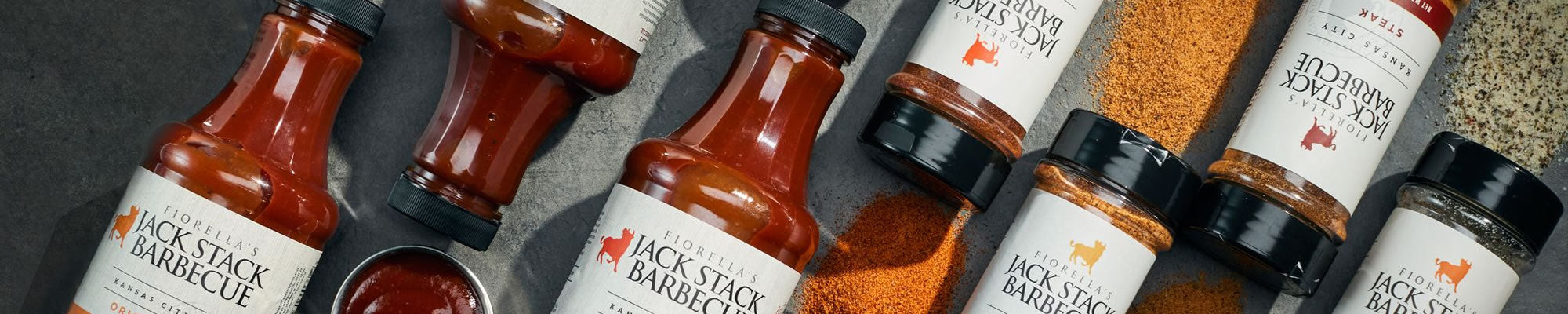 Alternate facing Jack Stack Barbecue sauces and rub jars.